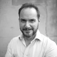 Headshot image of Ian M of Qualtrics, the image is in black and white