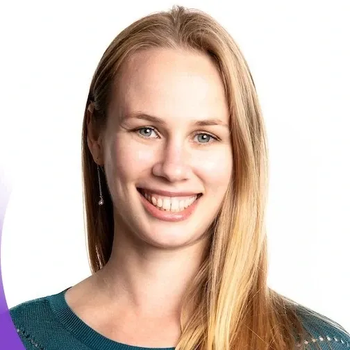 A headshot image of a person who is smiling