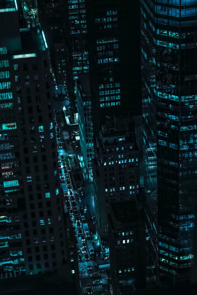 A city at night with many tall buildings